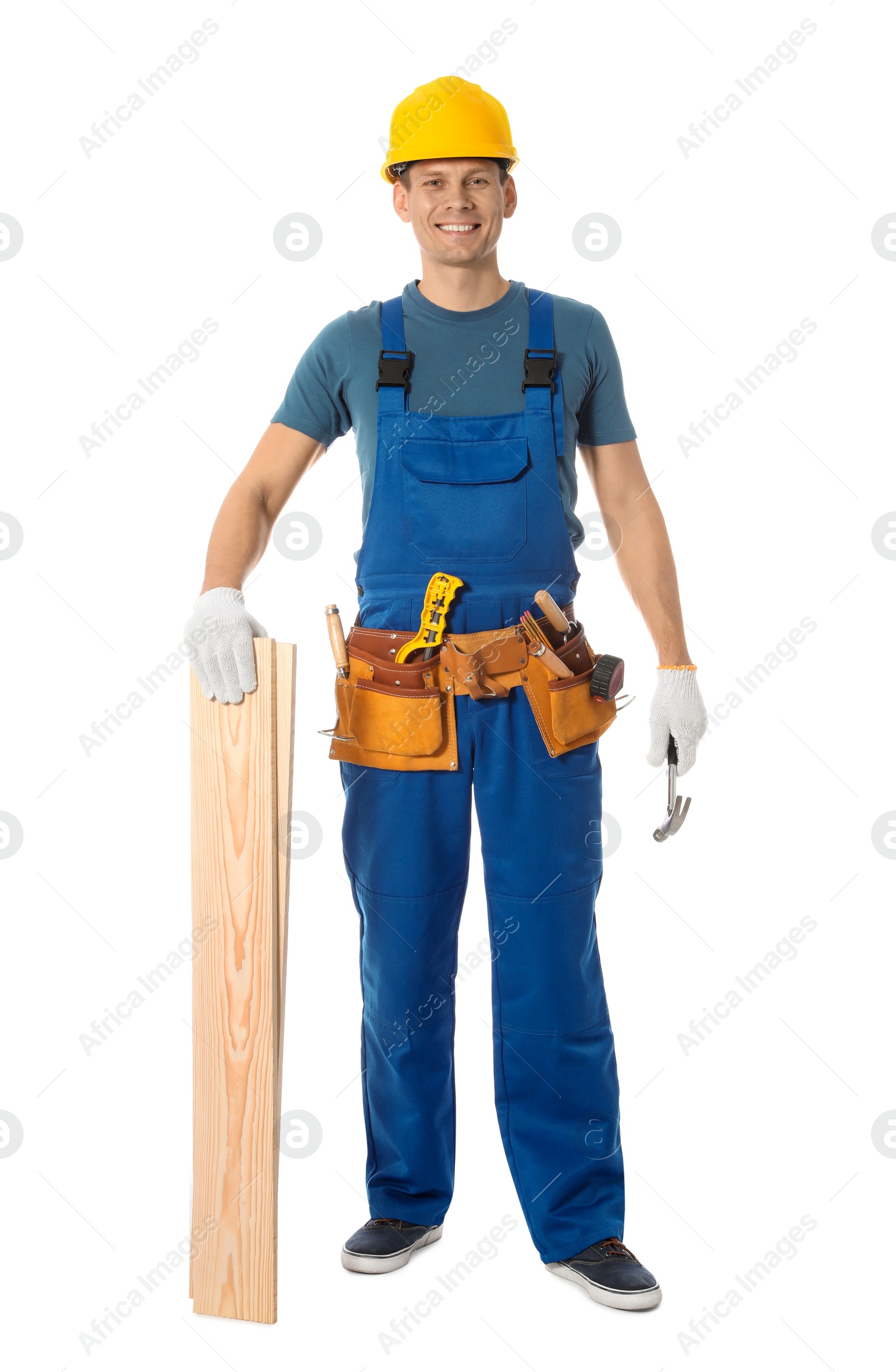 Photo of Handsome carpenter with wooden planks isolated on white