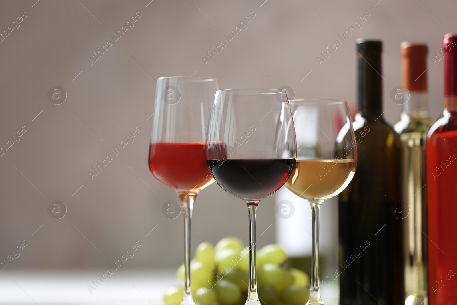 Photo of Different glasses with wine served on table