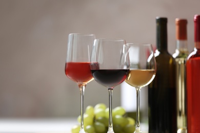 Different glasses with wine served on table