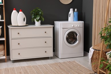 Laundry room interior with washing machine and furniture