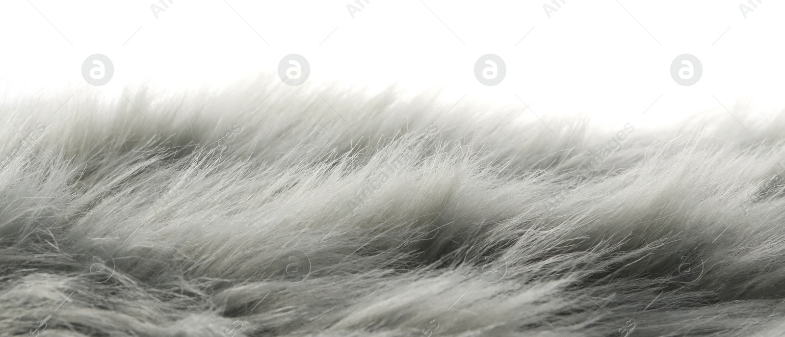 Photo of Soft grey faux fur isolated on white