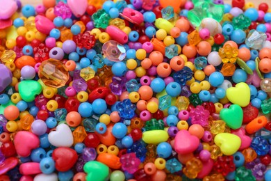 Photo of Many different bright beads as background, closeup