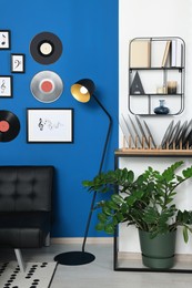 Photo of Vinyl records on wooden stand in living room