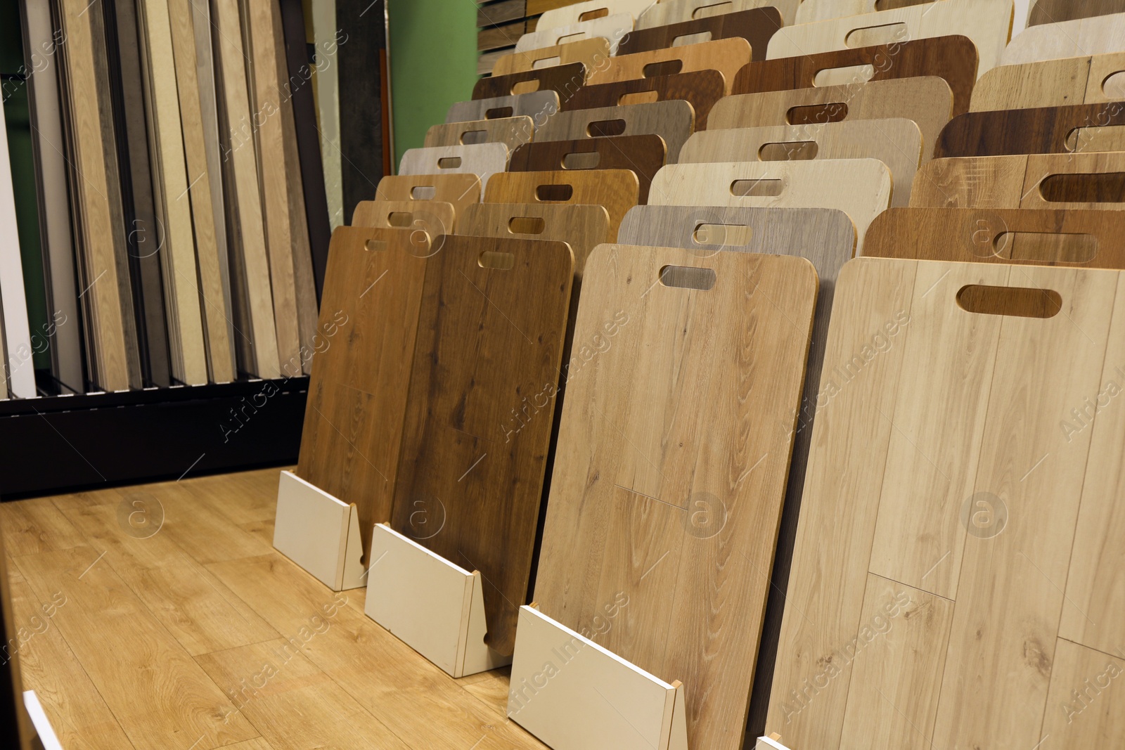 Photo of Many different samples of wooden flooring in store