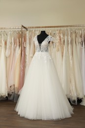 Beautiful wedding dress on mannequin in boutique