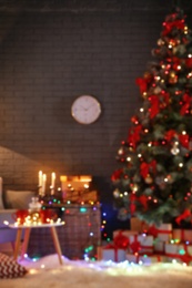 Photo of Blurred view of stylish room interior with decorated Christmas tree