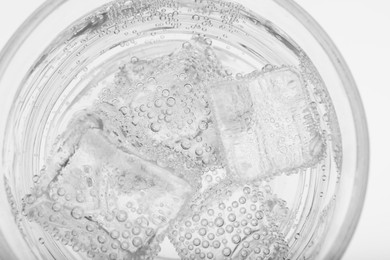 Top view of soda water with ice in glass