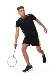 Photo of Young man playing badminton with racket on white background