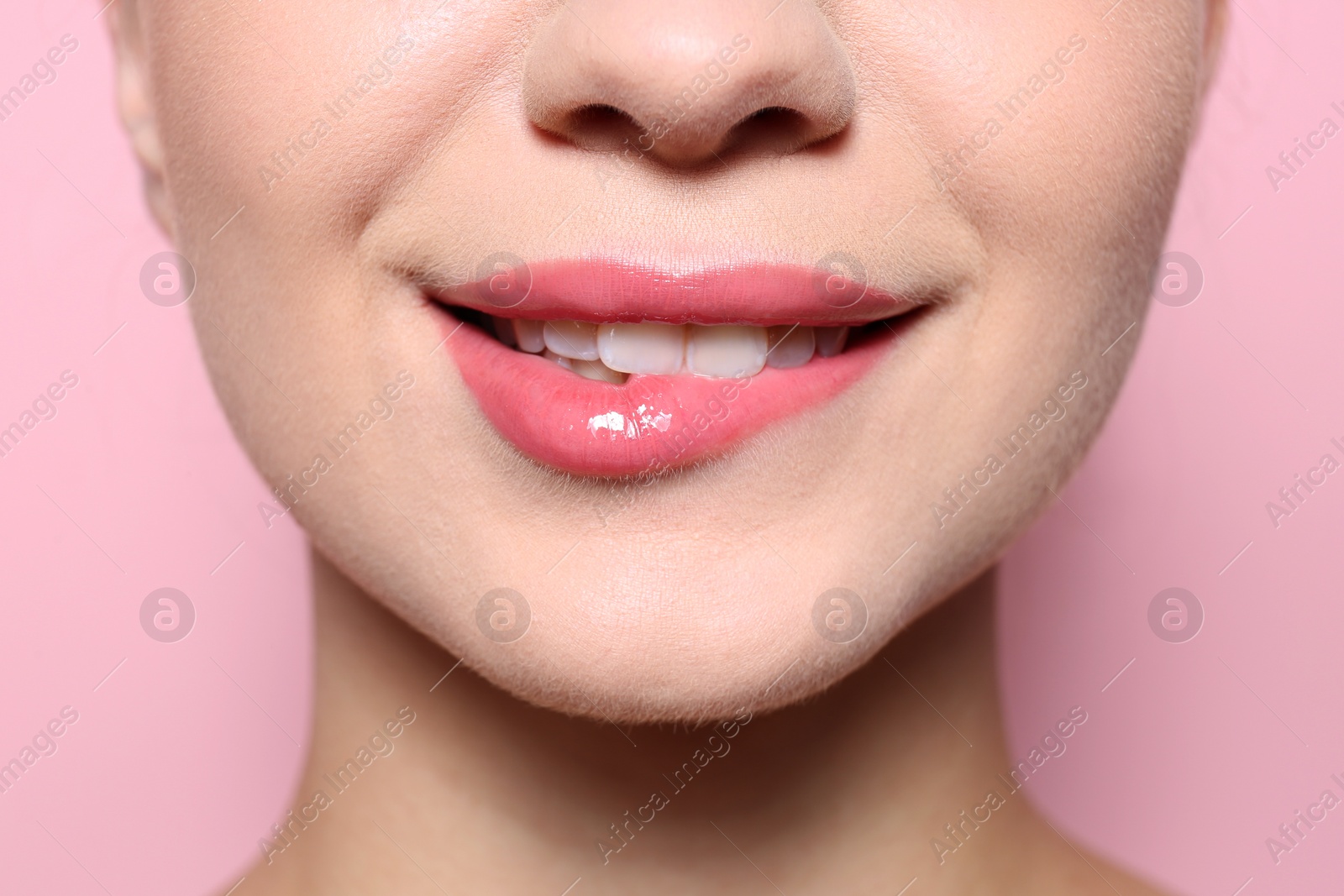 Photo of Beautiful young woman with perfect lips makeup on color background, closeup