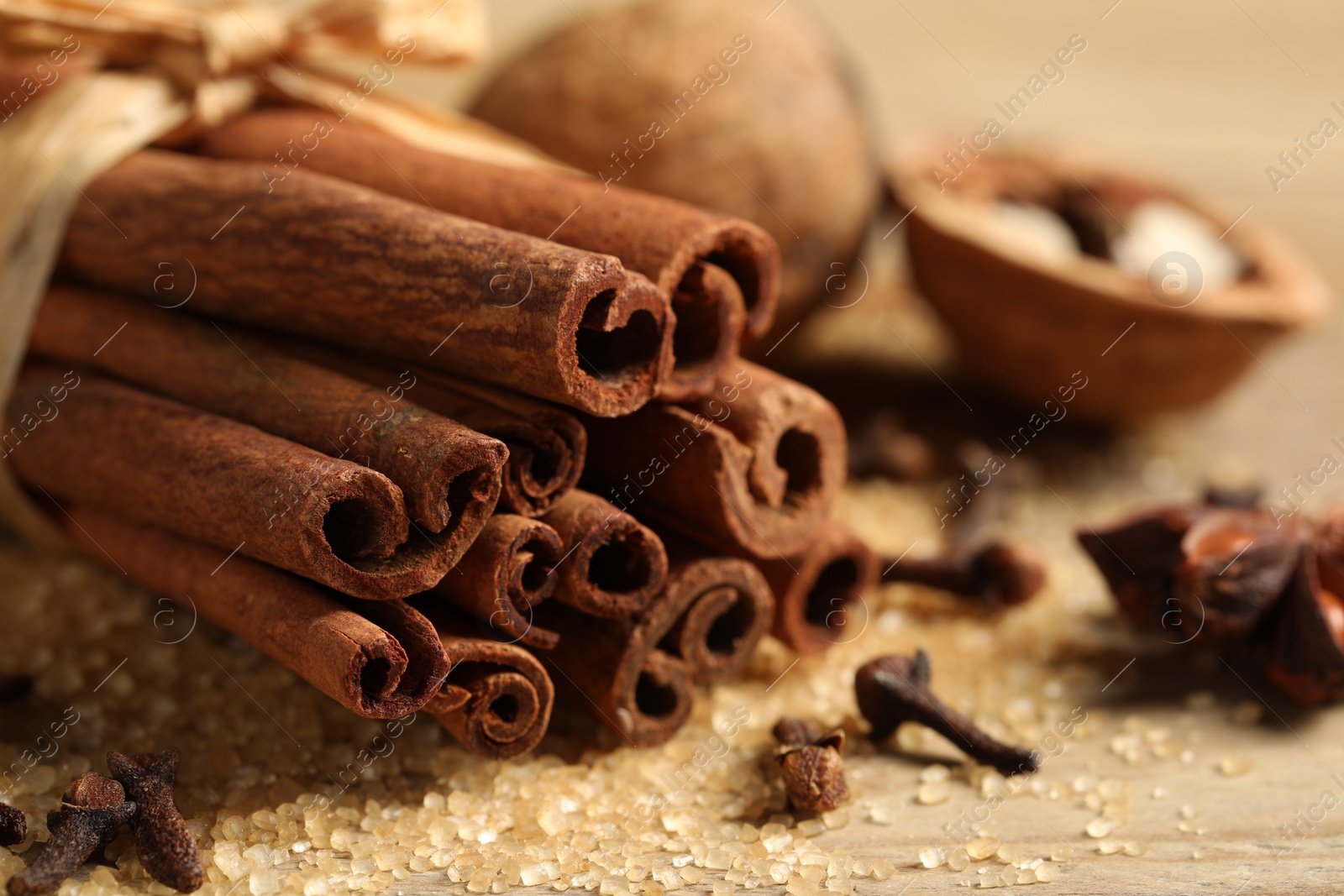 Photo of Different aromatic spices on table, closeup view