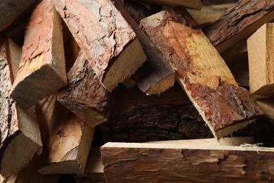 Photo of Cut firewood as background, closeup. Heating in winter