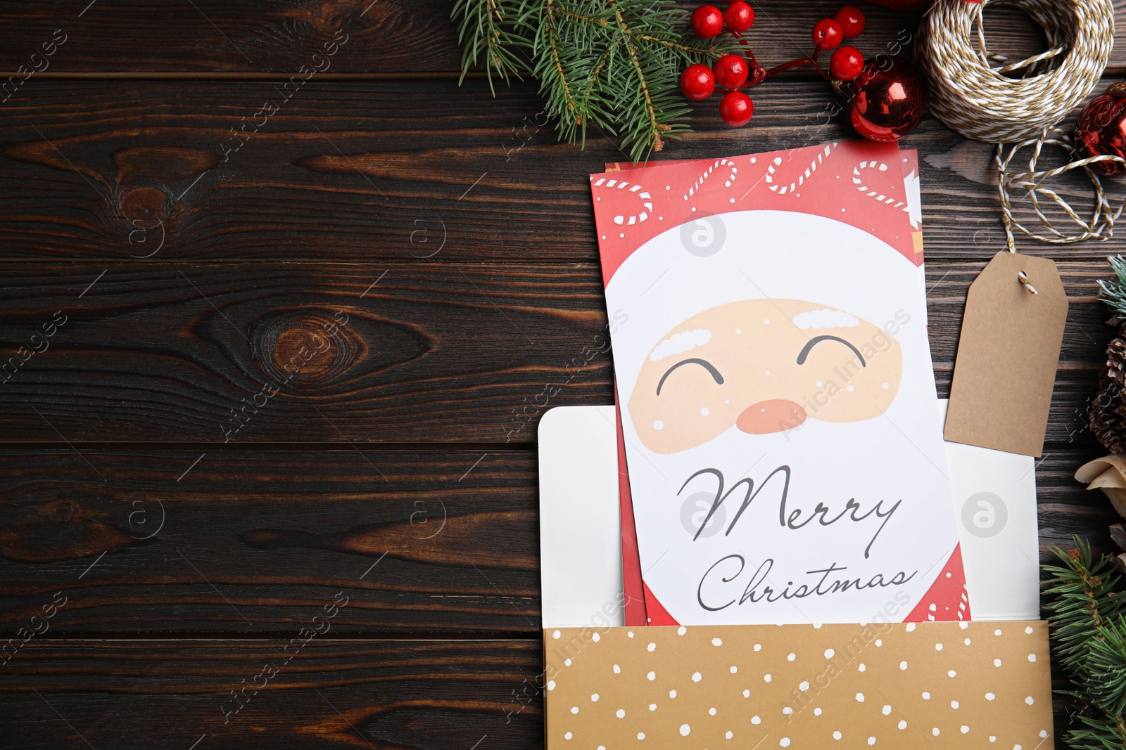 Photo of Flat lay composition with Christmas cards on wooden background, space for text