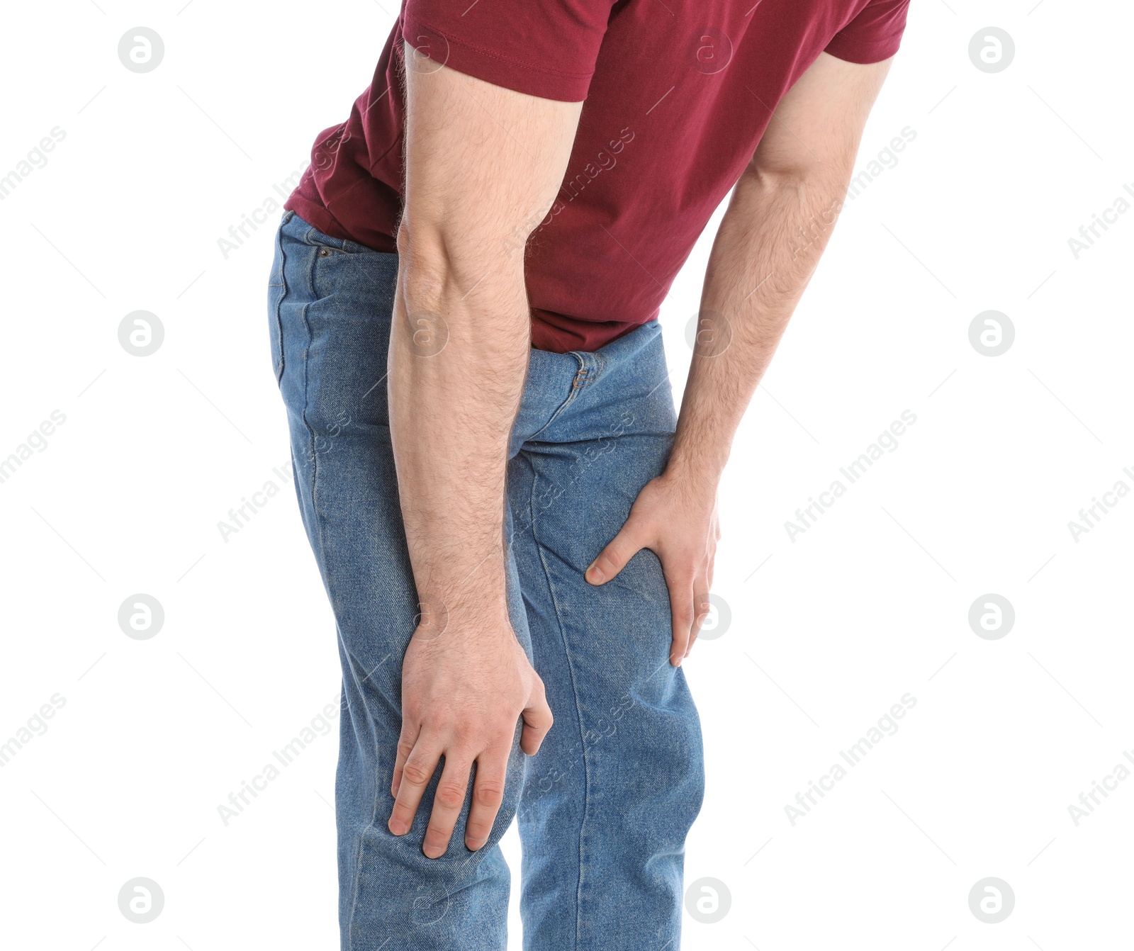 Photo of Young man suffering from leg pain on white background, closeup