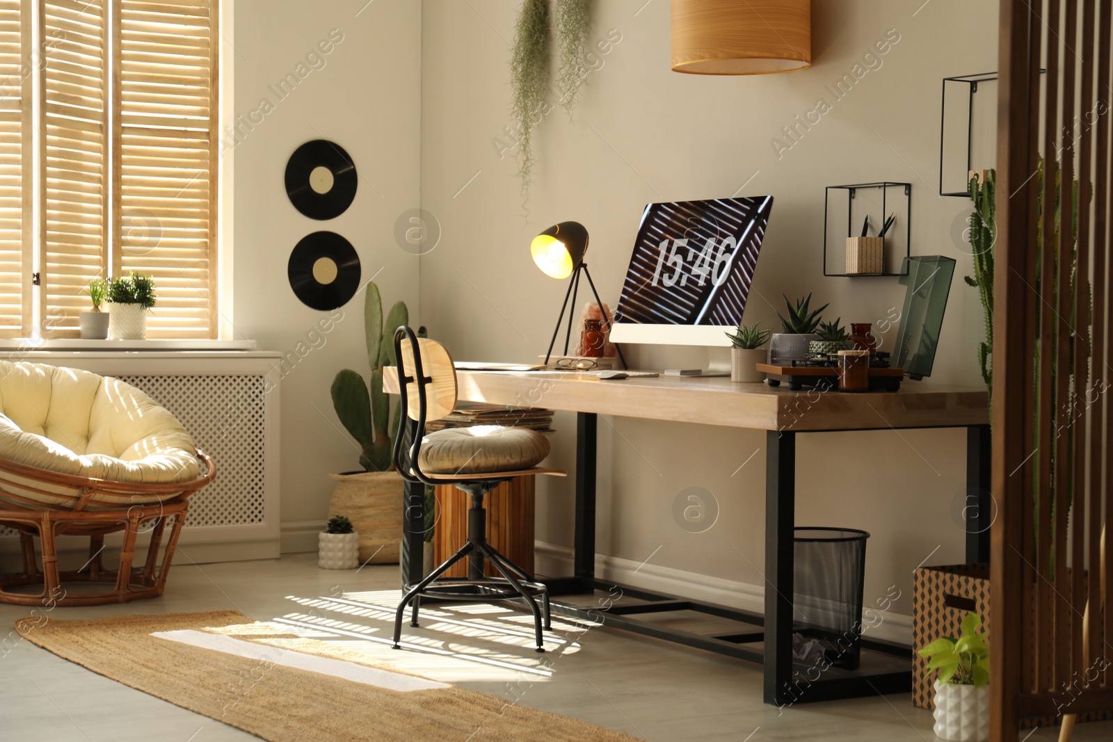 Photo of Room interior with comfortable workplace. Modern computer on wooden desk