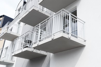 Photo of Exterior of beautiful building with empty balconies