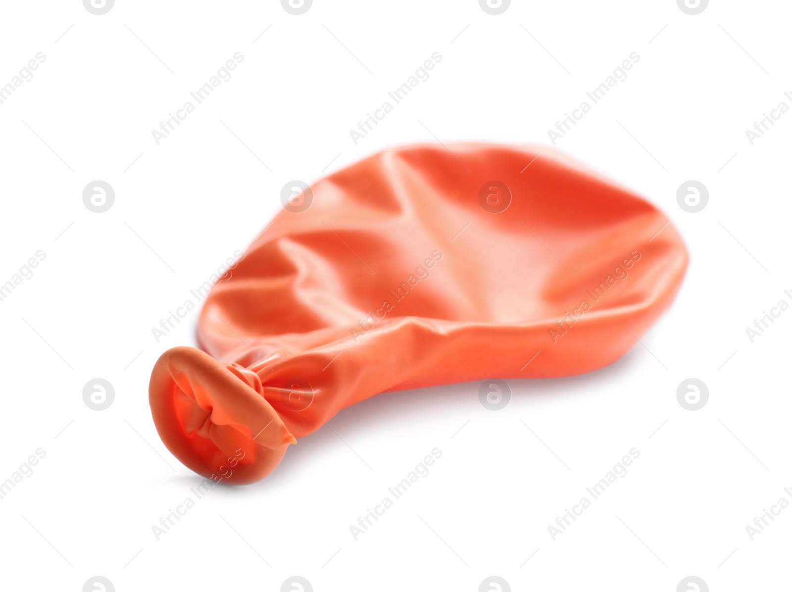 Photo of Deflated color air balloon on white background