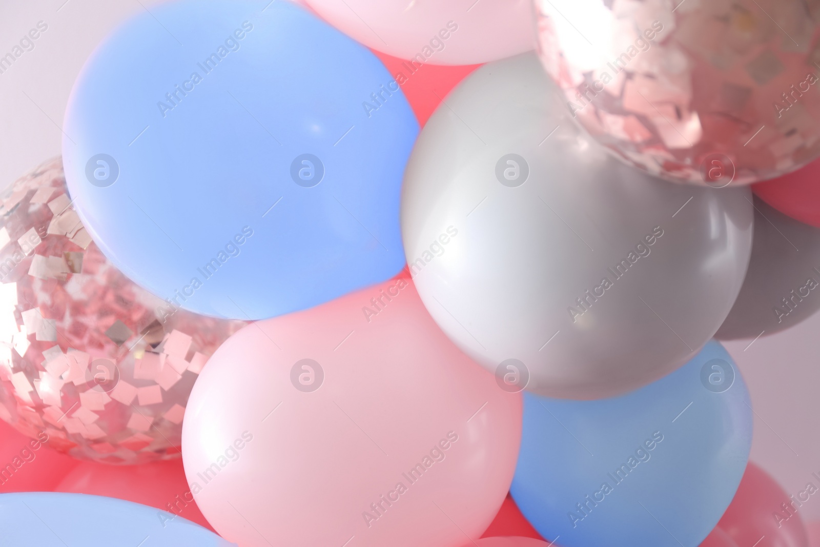 Image of Beautiful colorful balloons on light background, closeup. Party decor 