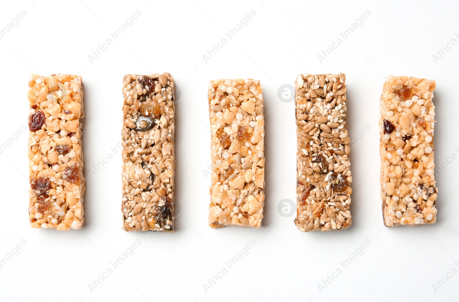 Photo of Different grain cereal bars on white background. Healthy snack