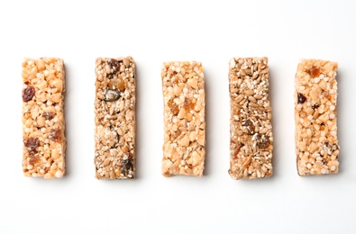 Different grain cereal bars on white background. Healthy snack