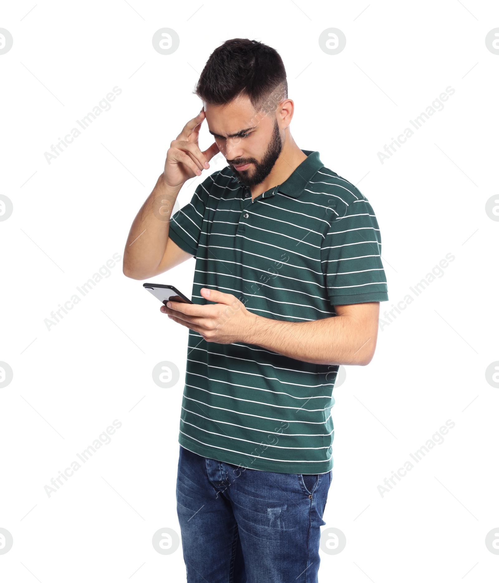 Photo of Portrait of handsome young man with mobile phone on white background