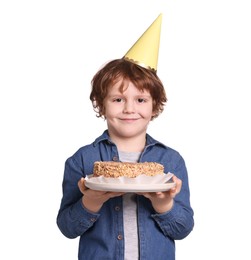 Birthday celebration. Cute little boy in party hat holding tasty cake on white background