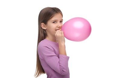 Girl inflating pink balloon on white background