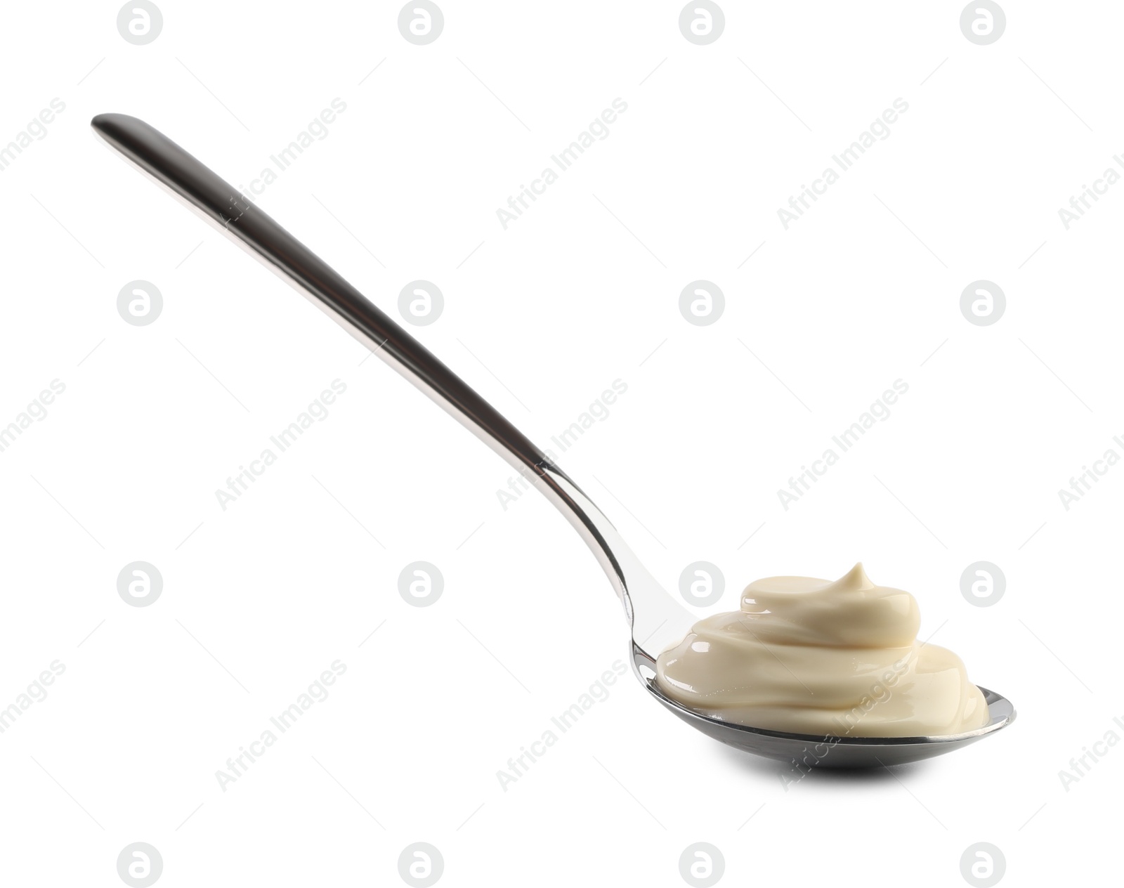 Photo of Natural yogurt in spoon isolated on white