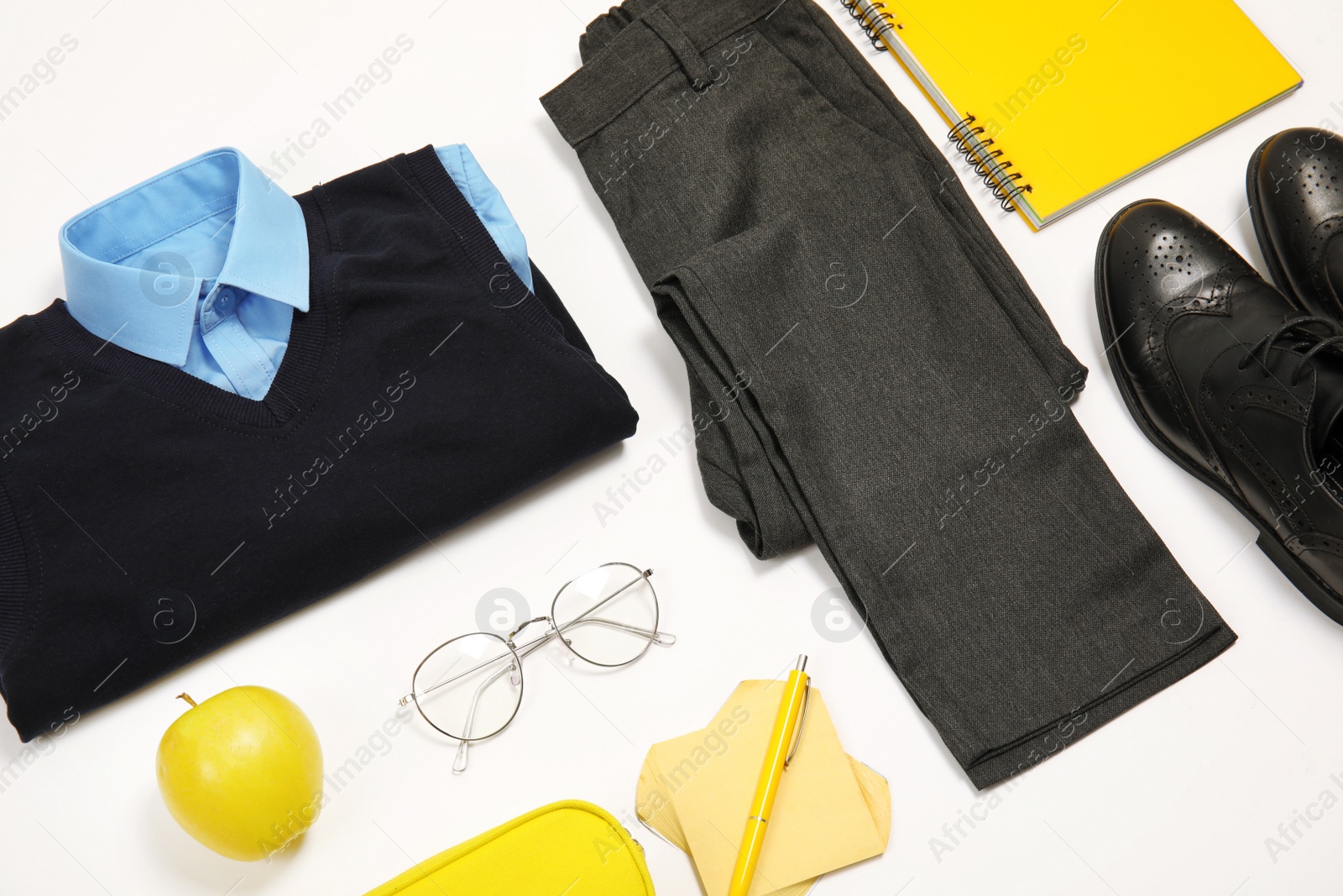 Photo of Composition with school uniform for boy on white background