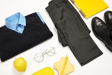 Composition with school uniform for boy on white background