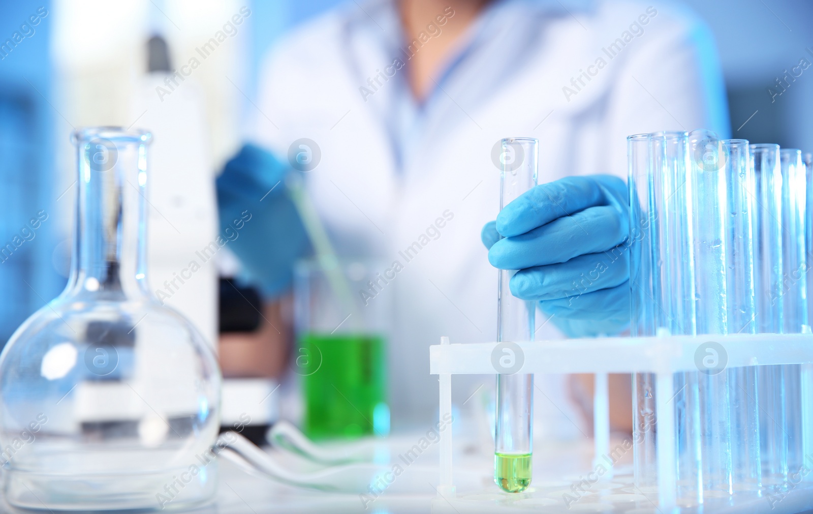 Photo of Female scientist working in chemistry laboratory, closeup