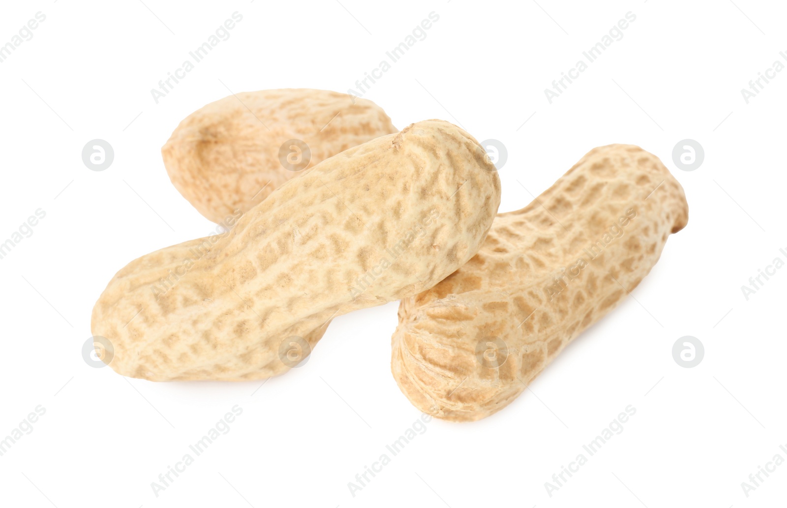 Photo of Three fresh unpeeled peanuts isolated on white