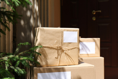 Photo of Delivered parcels on door mat near entrance