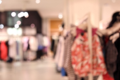 Blurred view of modern store with different clothes