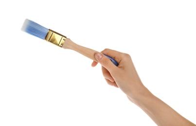 Photo of Woman holding paint brush on white background, closeup