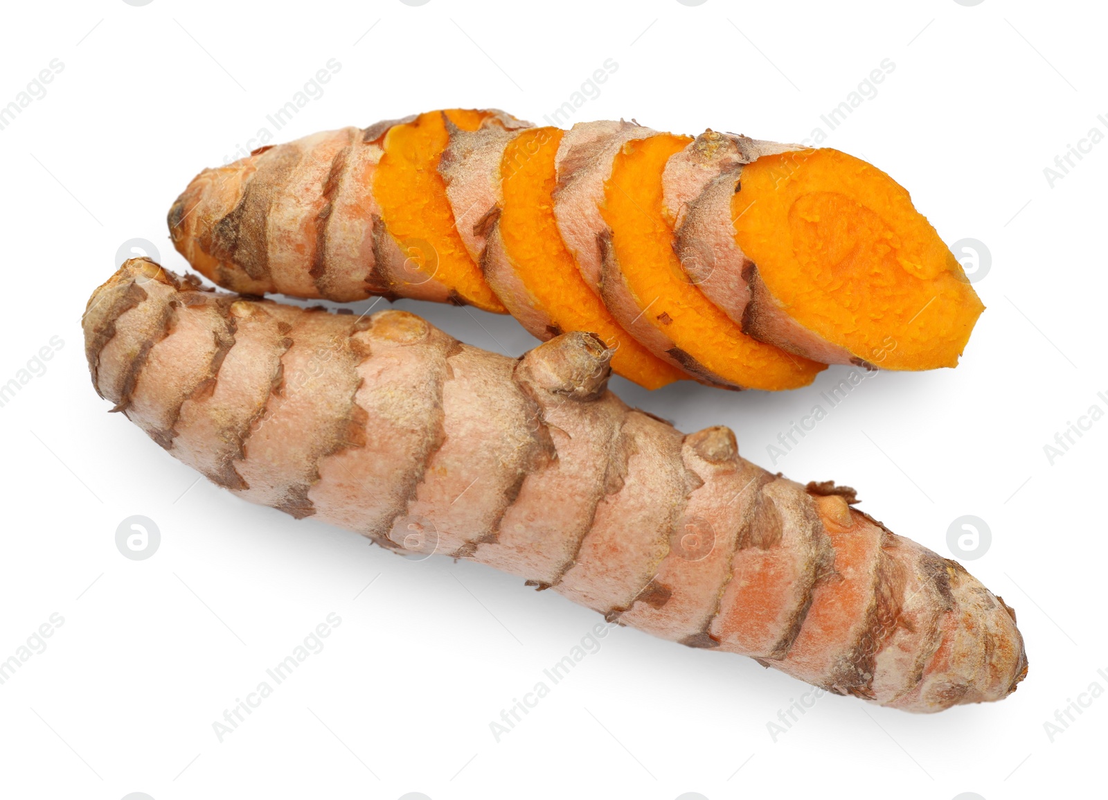 Photo of Whole and cut turmeric roots isolated on white, top view