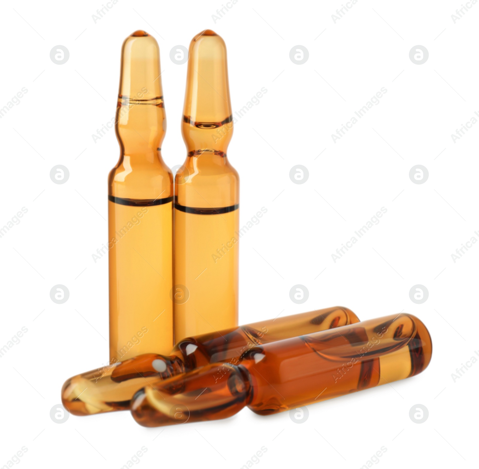 Photo of Brown pharmaceutical ampoules with medication on white background