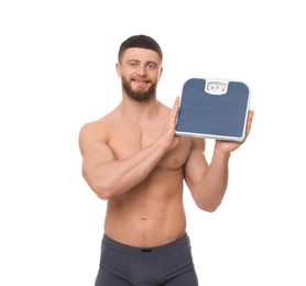 Portrait of happy athletic man with scales on white background. Weight loss concept