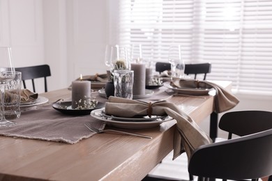 Photo of Festive table setting with beautiful tableware and decor indoors