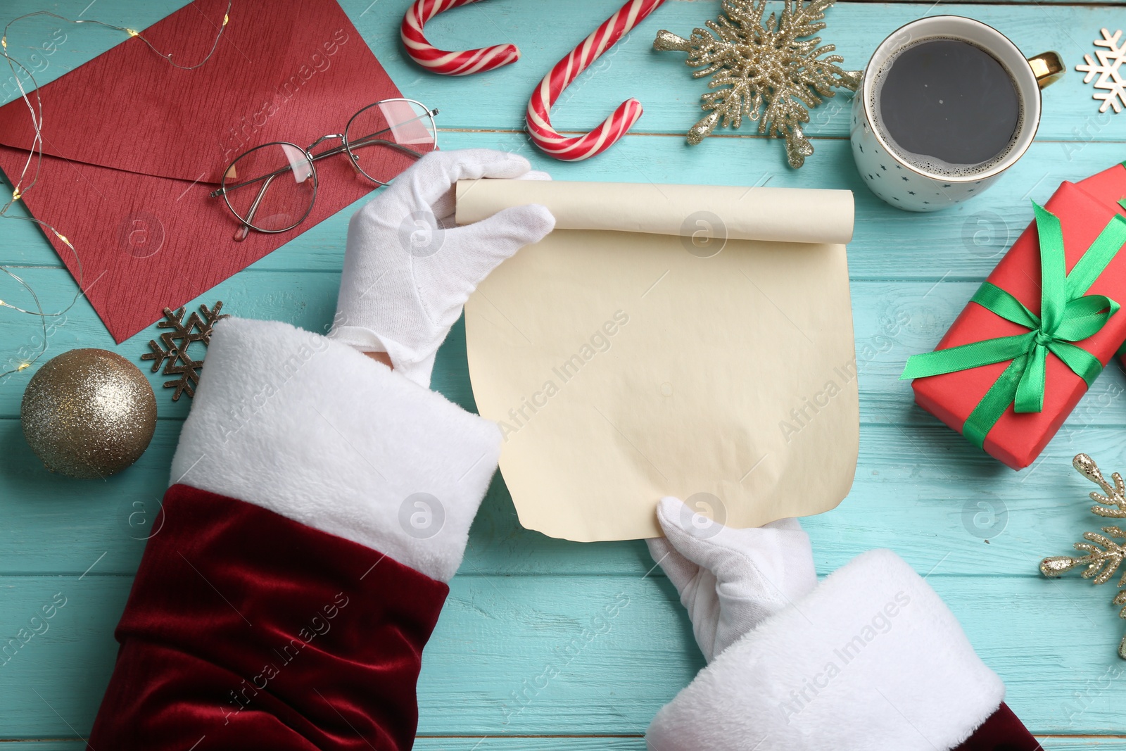 Photo of Santa letter at turquoise wooden table, top view