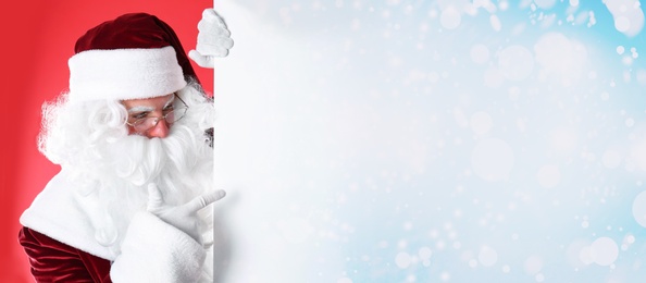 Image of Santa Claus with banner on red background. Space for design