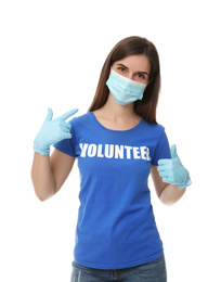 Photo of Female volunteer in mask and gloves on white background. Protective measures during coronavirus quarantine