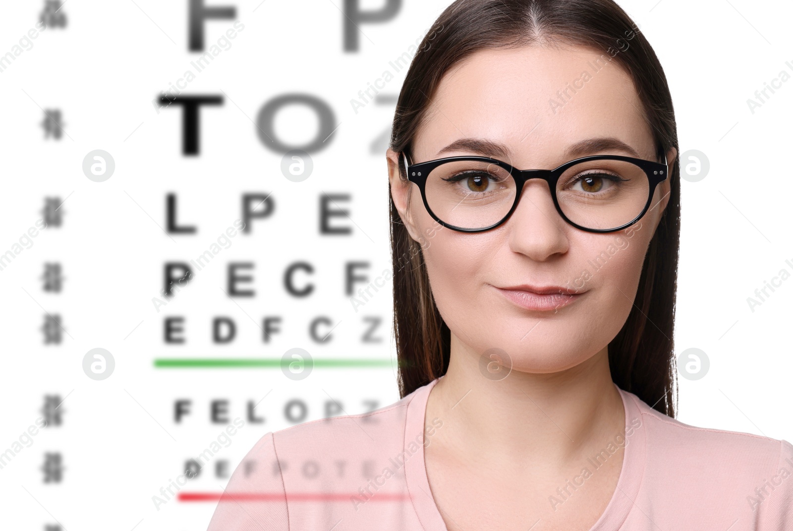 Image of Vision test. Woman in glasses and eye chart on white background