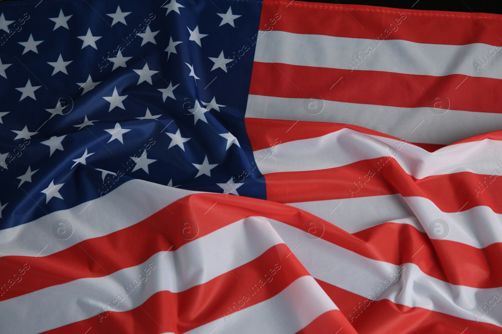 Photo of Flag of USA on black table, top view