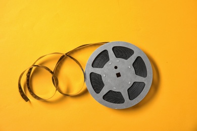 Movie reel on color background, top view. Cinema production