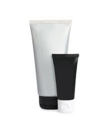 Tubes of men's facial creams on white background. Mockup for design