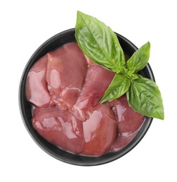 Bowl of raw chicken liver with basil isolated on white, top view