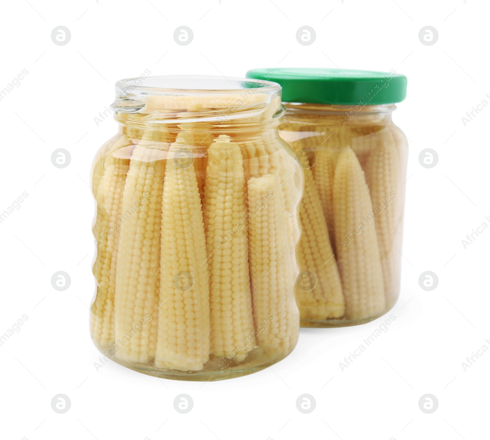 Photo of Jars of pickled baby corn isolated on white