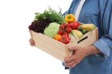 Harvesting season. Farmer holding wooden crate with vegetables on white background, closeup