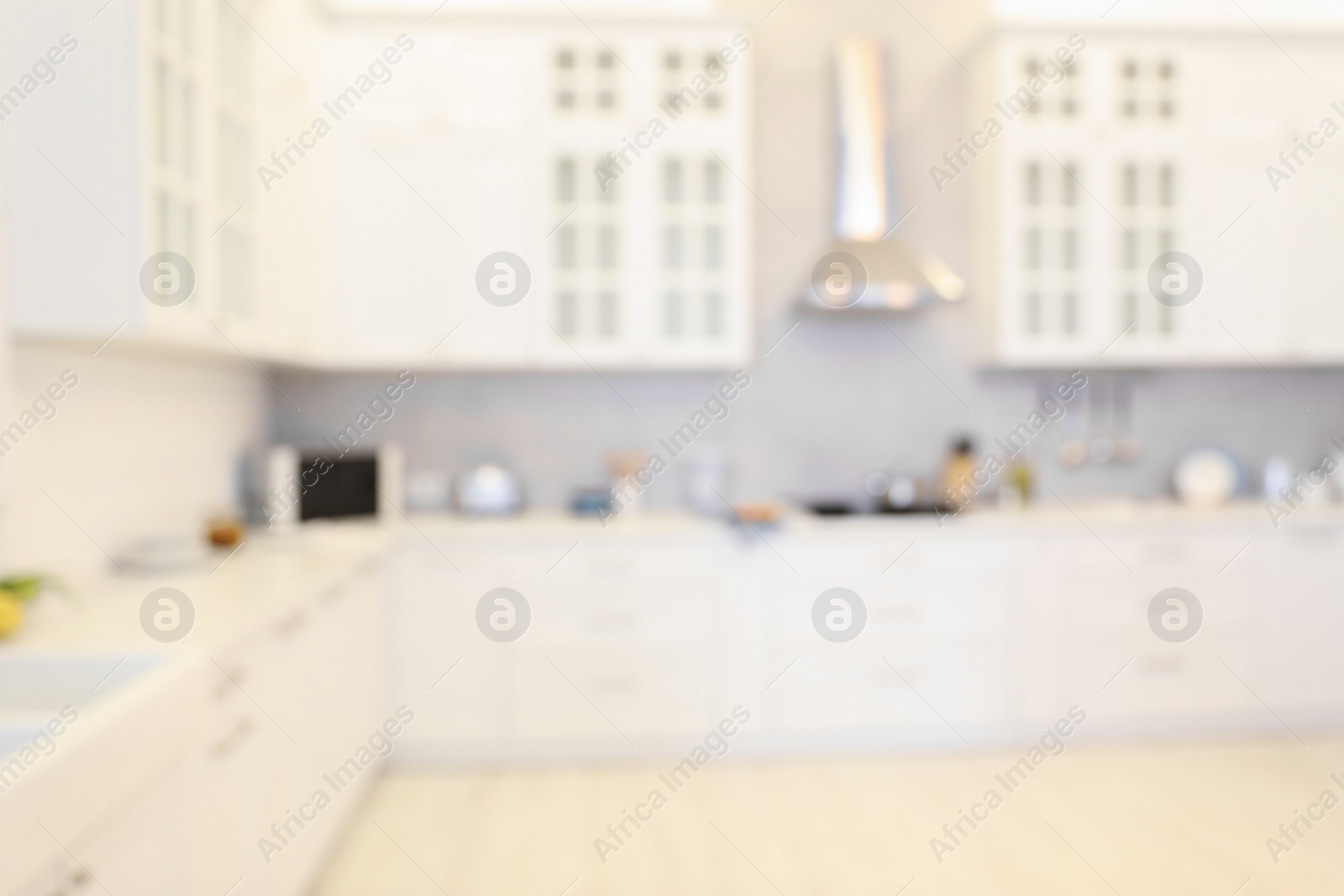 Photo of Blurred view of modern kitchen. Interior design