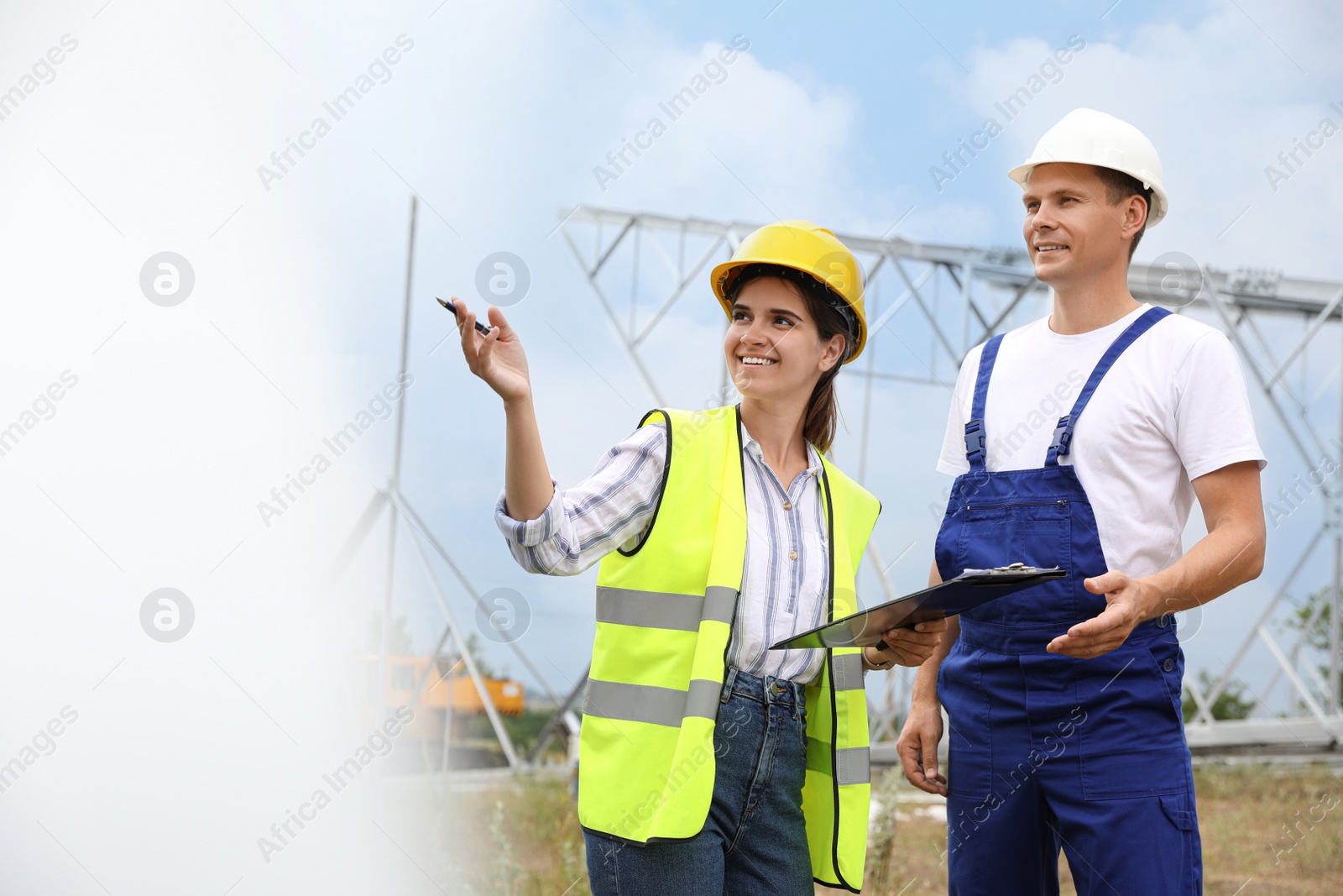 Photo of Professional engineers working on installation of electrical substation outdoors